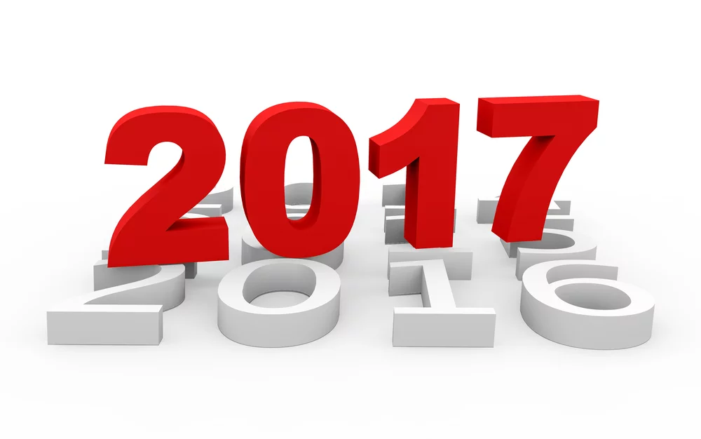 Large red "2017" stands upright in front of white "2016" and earlier years, symbolizing the transition to the new year.
