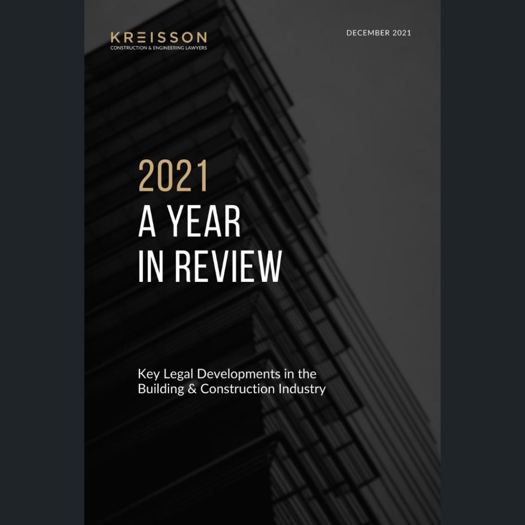 Cover of a report titled "2021 A Year in Review: Key Legal Developments in the Building & Construction Industry" by Kreisson, dated December 2021, with a building in the background.